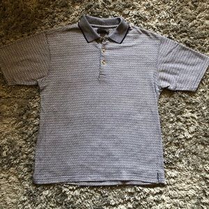 Worn navy blue and white Van Heusen polo